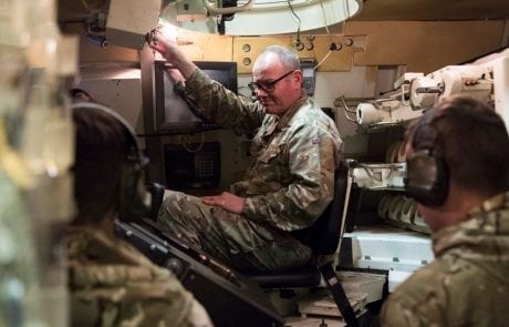 solider in a tank simulator wearing headset
