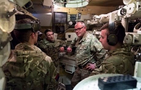 solider in a tank simulator wearing headset