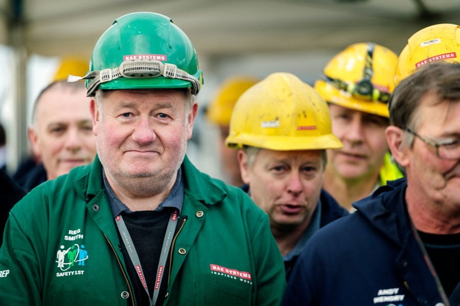 A team of people in colourful hardhats