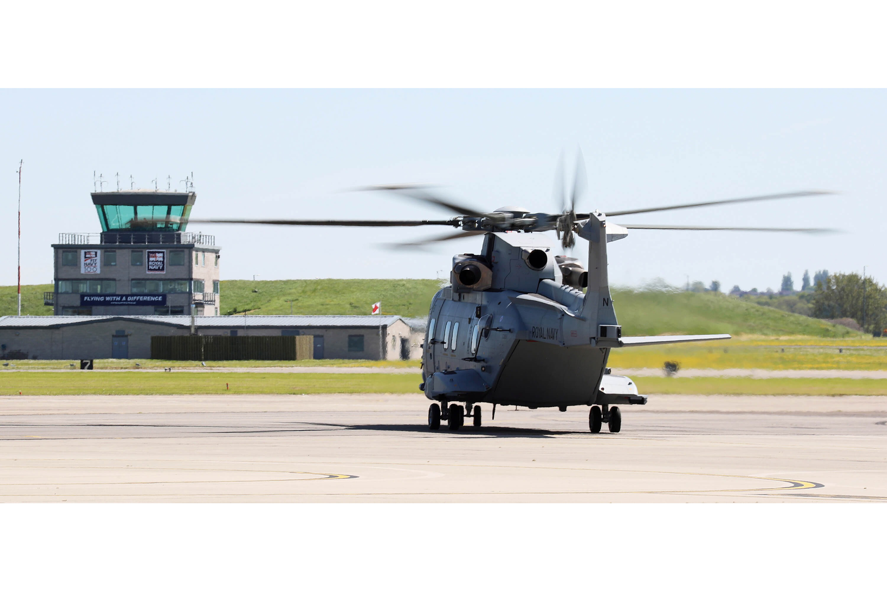 A helicopter on a runway seen from behind