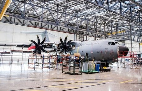A large military plane in a hangar
