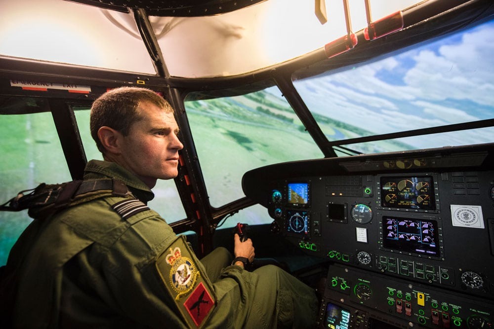 A pilot inside a helicopter simulator