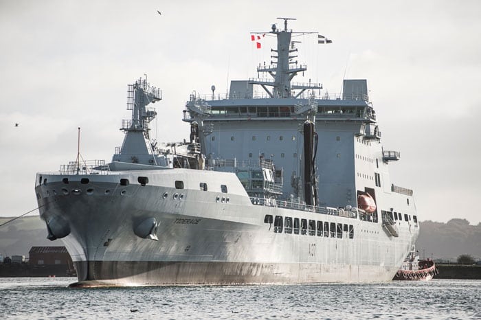 A large grey navy tanker ship at sea