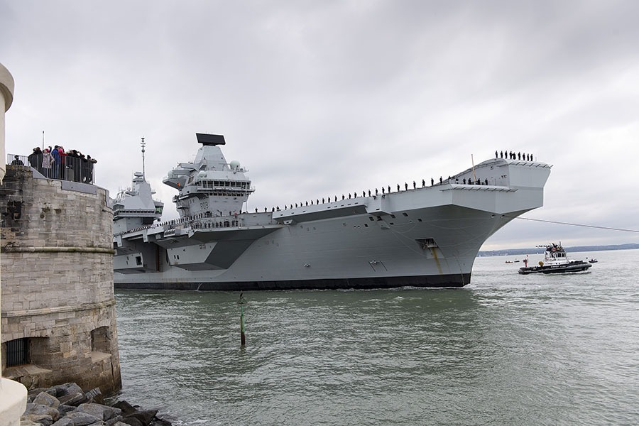 Large Royal Navy ship sailing into Portsmouth harbour