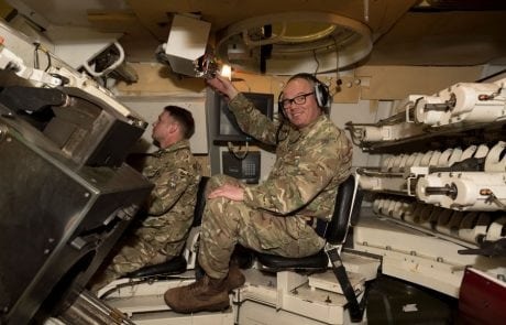solider in a tank simulator wearing headset