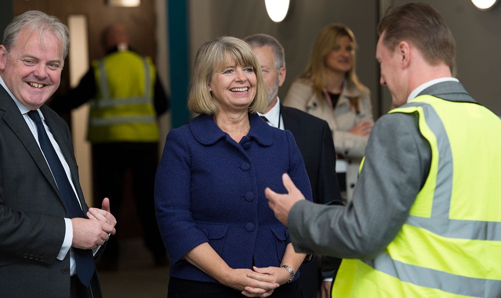 harriett baldwin mp talking to man in hi-vis at ajax factory