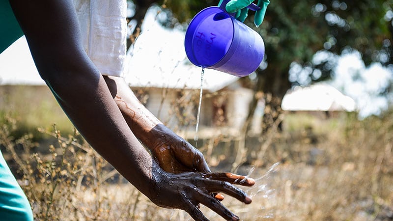 water pouring over a hand