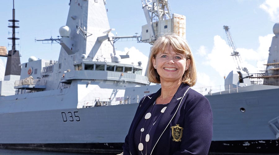 MP Harriett Baldwin stood smiling with Type 45 navy warship