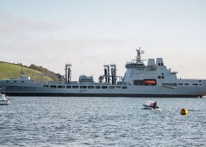 A large grey navy tanker ship at sea