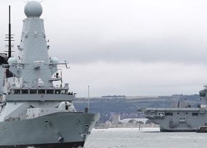 A large navy ship at sea