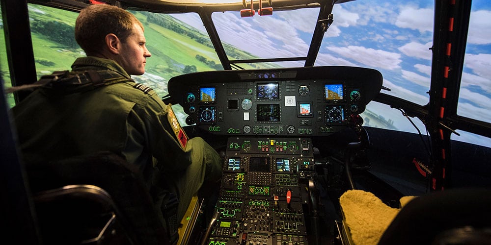 A pilot inside a helicopter simulator