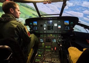 A pilot inside a helicopter simulator