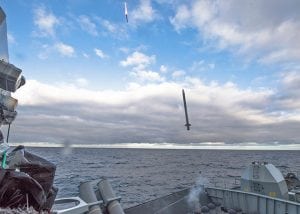 Missile firing from the deck of a ship