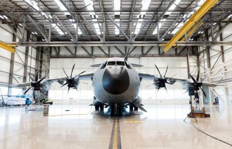 A large military plane in a hangar