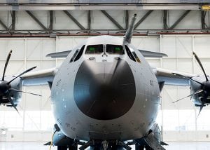 A large military plane in a hangar