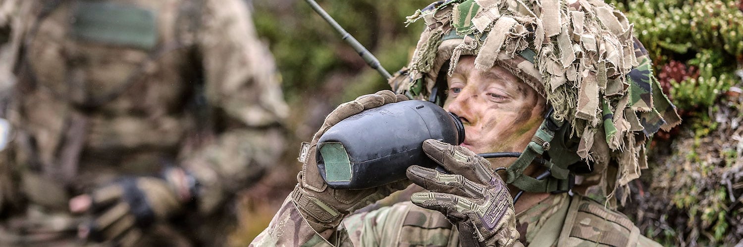 Soldier drinking water from a flask