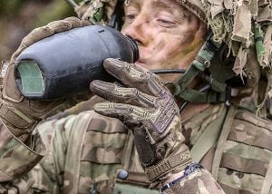 Soldier drinking water from a flask