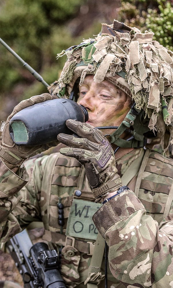 Soldier drinking water from a flask