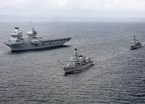 Two navy ships sailing in formation