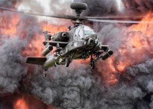 A helicopter flies through an explosion