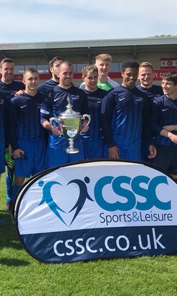 MOD football team lift a trophy