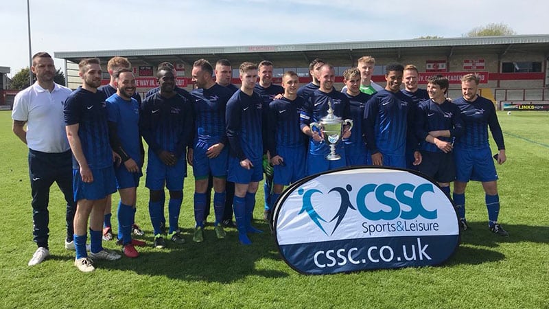 MOD football team lift Lewis Cup MOD football team lift a trophy