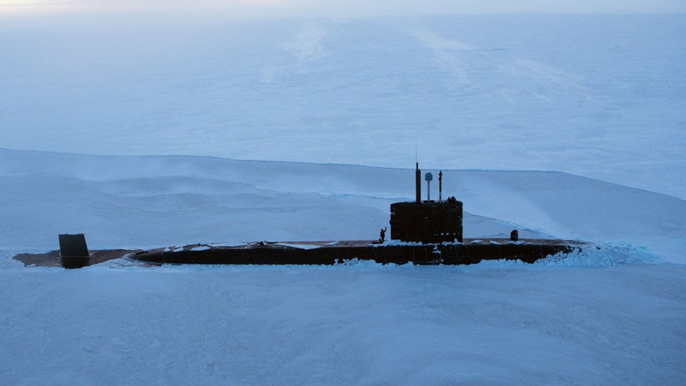 A submarine breaks through the ice in the arctic