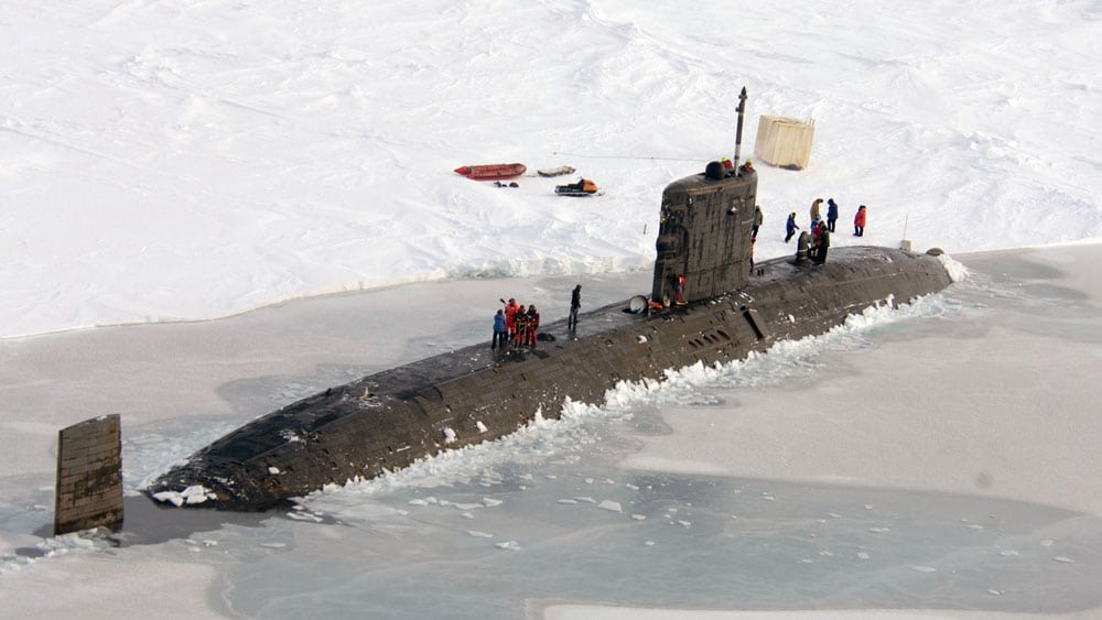 A submarine breaks through the ice in the arctic
