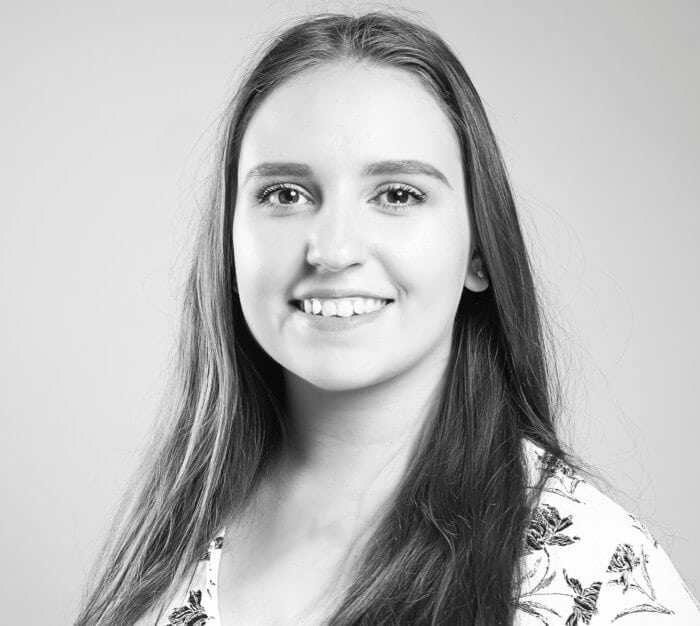 DE&S employee with brown hair smiling, part of the Business administration support team in Bristol at DE&S