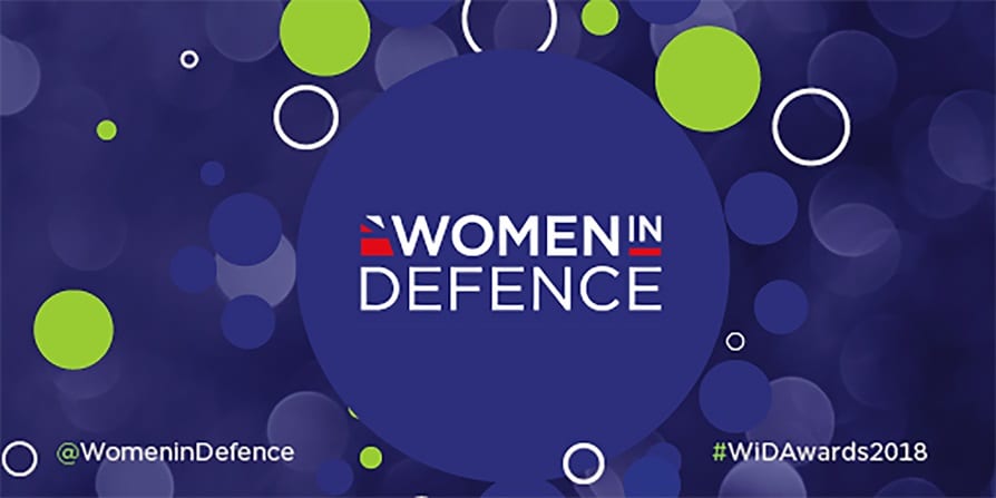 The Women in Defence logo on a purple background with green spots around it