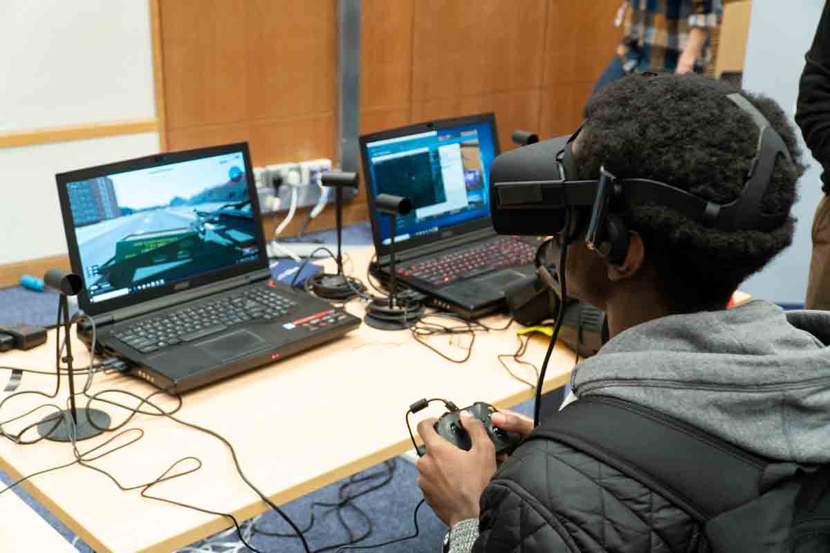 A child plays a computer game with a headset on