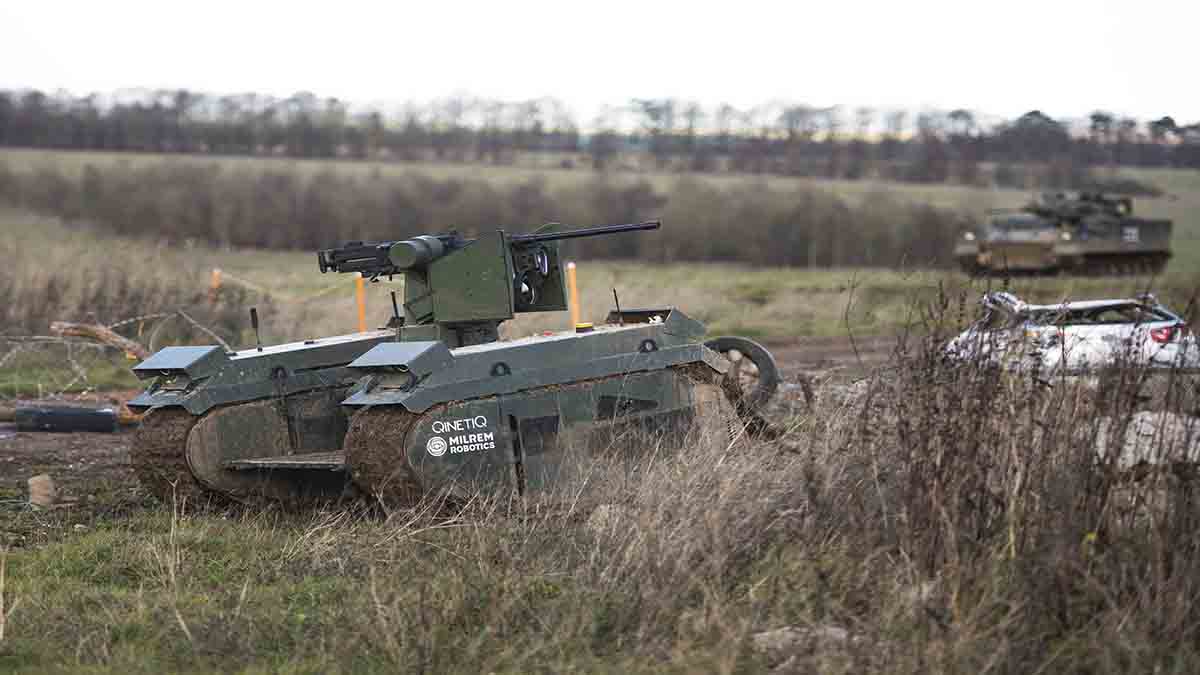 A robotic tank driving across grassland