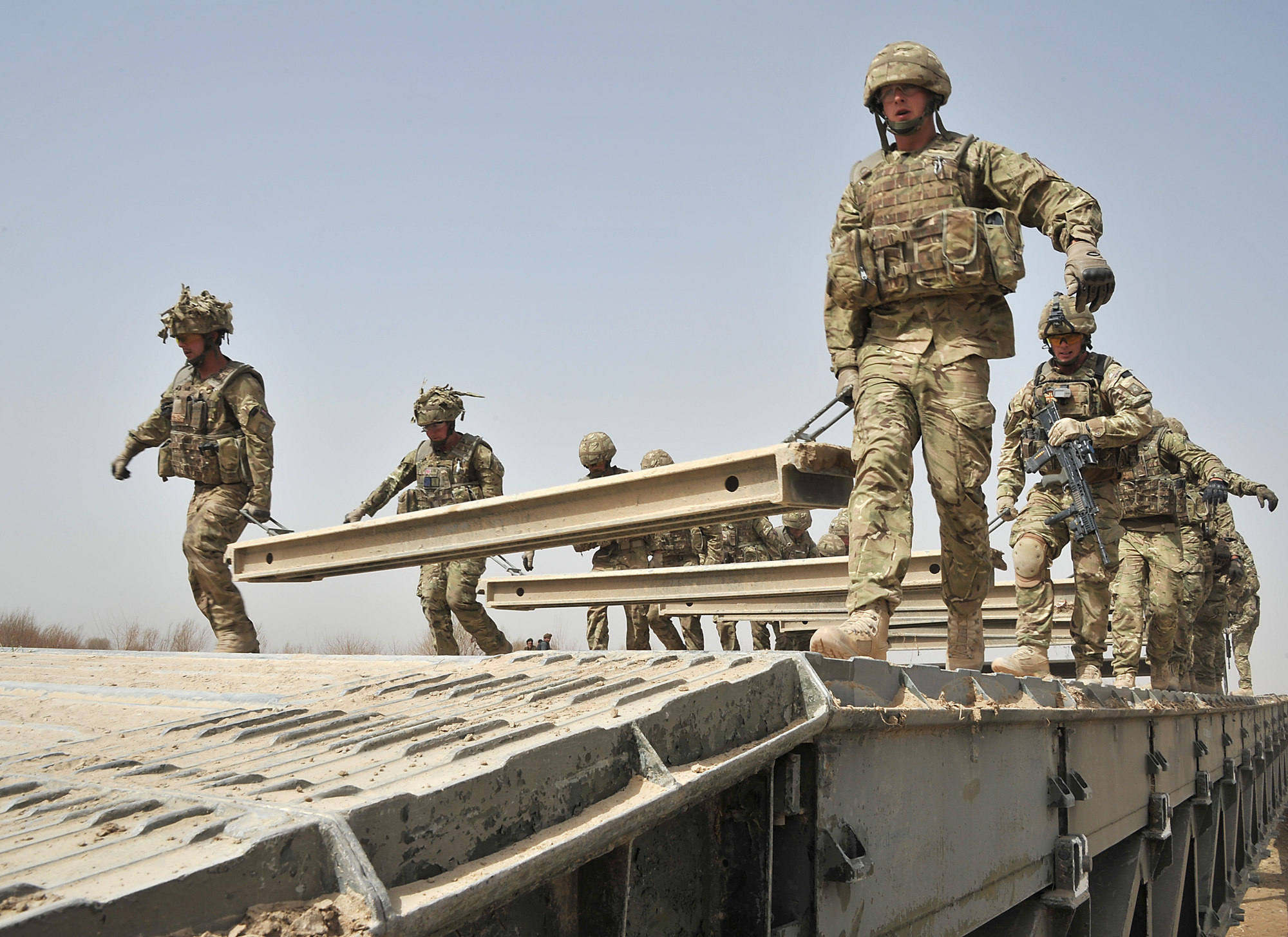 Royal Engineers from 37 Squadron working with a Medium Girder Bridge (MGB) during an operation in Afghanistan. Crown Copyright.