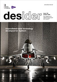 Front cover of October 2020 edition of Desider showing a large grey fighter jet plane sat in an illuminated hangar