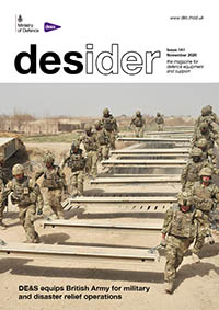 Front cover of November 2020 edition of Desider showing two rows of soliders carrying metal planks used to create a temporary road in the desert