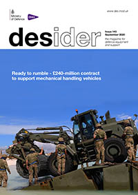 Front cover of September 2020 edition of Desider showing a digger being loaded off a boat on the shore by soliders