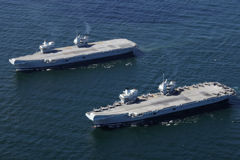 HMS Prince of Wales (rear) and HMS Queen Elizabeth pictured together at sea