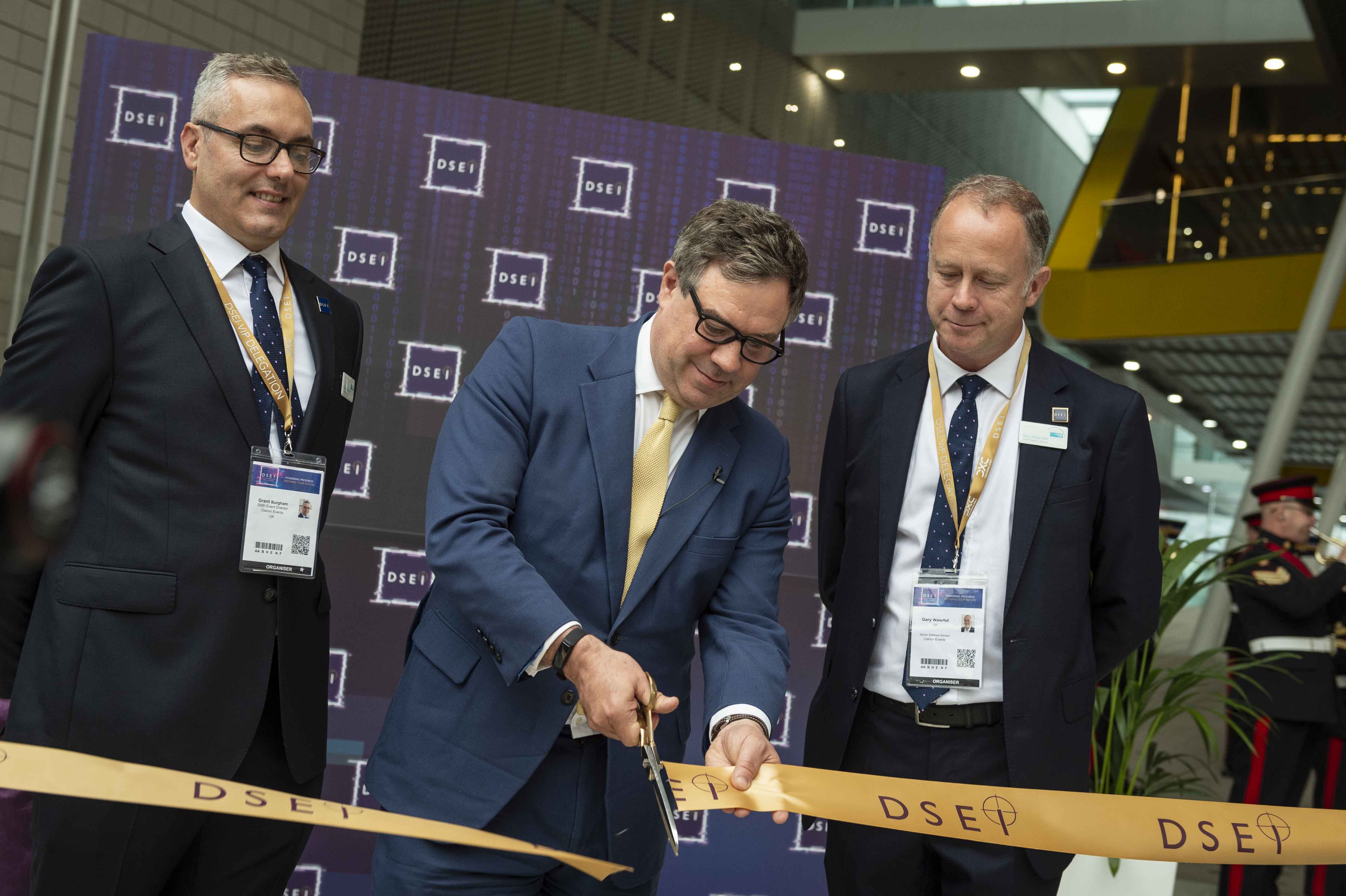 Minister for Defence Procurement, Jeremy Quin cuts the ribbon at the start of DSEI 2021