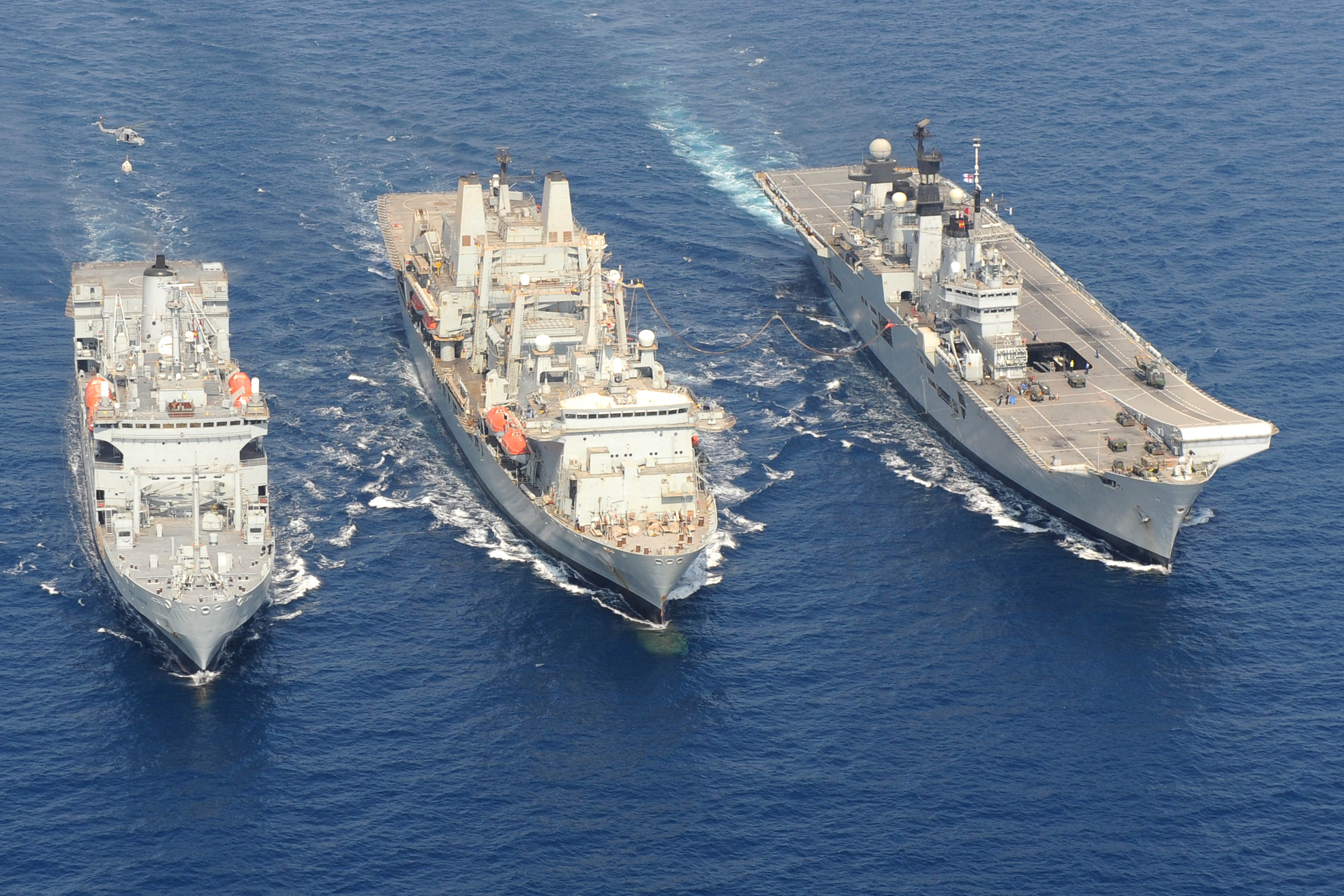RFA Fort Austin, RFA Fort Victoria and HMS Illustrious at sea
