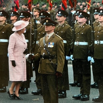 Her Majesty inspects soldiers on parade