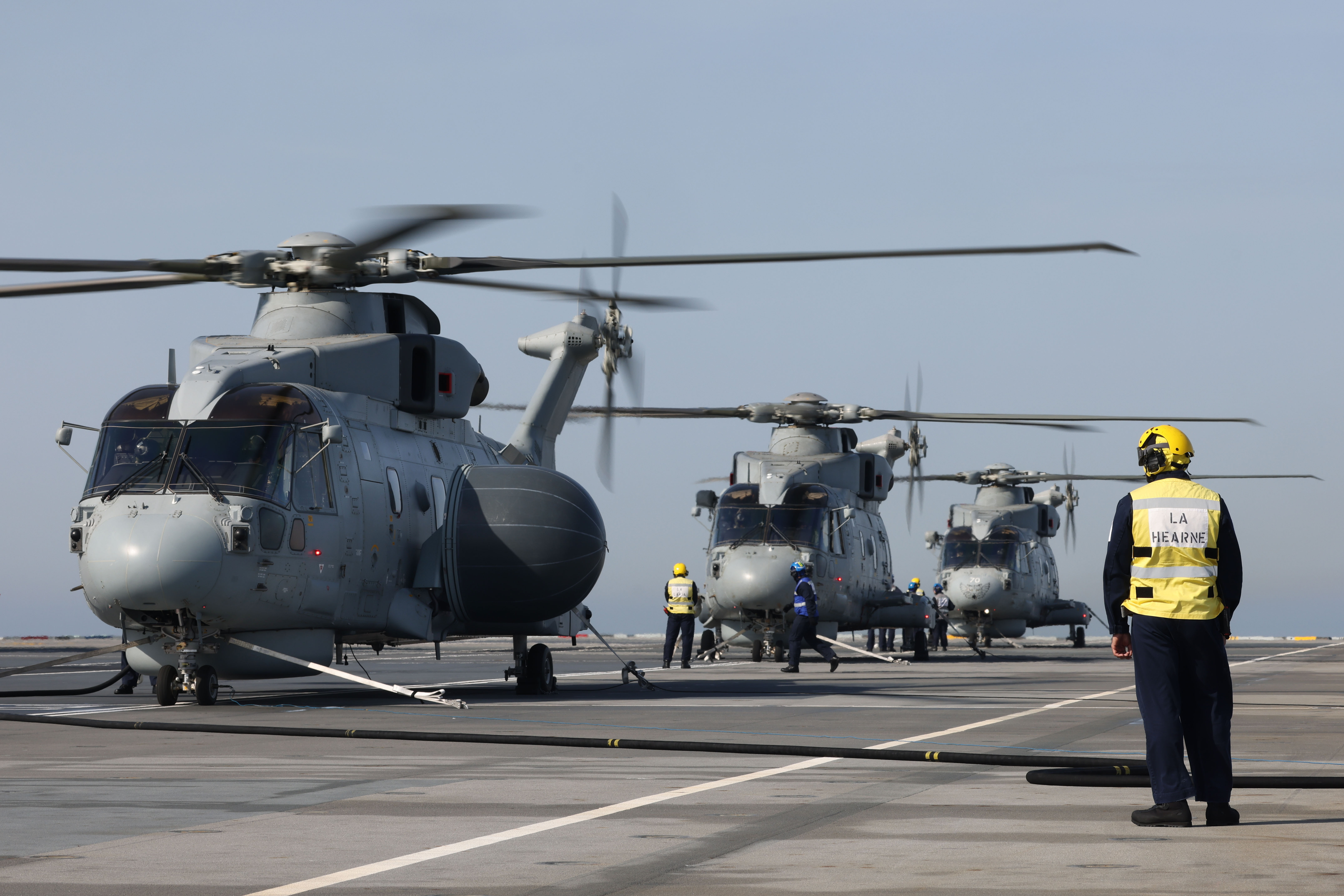 A Merlin helicopter on the deck of HMS Queen Elizabeth during the Carrier Strike Group deployment 2023