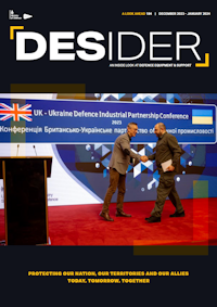 DE&S CEO Andy Start and Ukrainian Defence Minster Rustem Umerov shaking hands on a conference event stage. Credit: Zinchenko