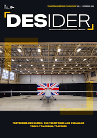 Front view of a Protector aircraft, in a hanger with a Union Flag behind it.
