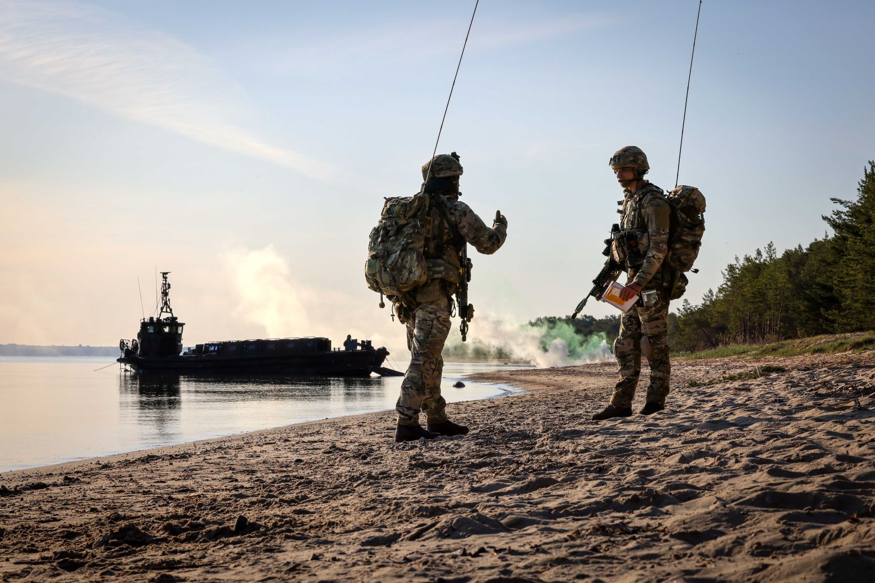 Royal Marines on a beach having deployed from HMS Albion