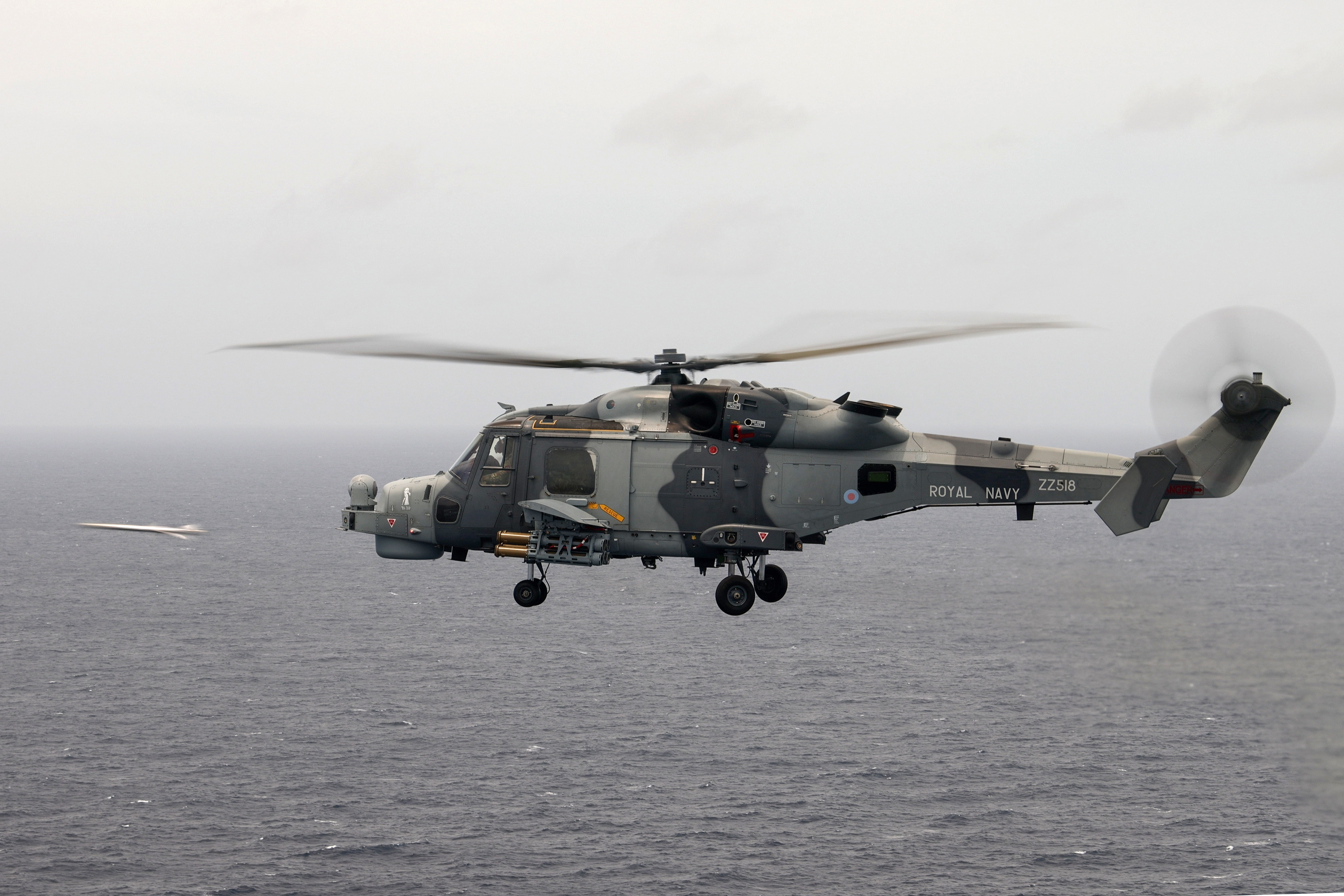 A Royal Navy Wildcat helicopter conducts live firing of the Martlet missile system during the Carrier Strike Group deployment of 2021