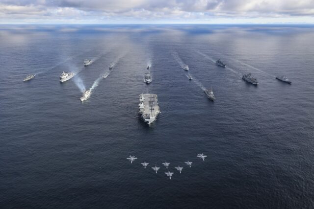 The Royal Navy's Carrier Strike Group sailing in formation