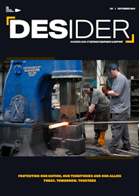 Desider front cover showing two people flattening a molten hot metal bar in a large press