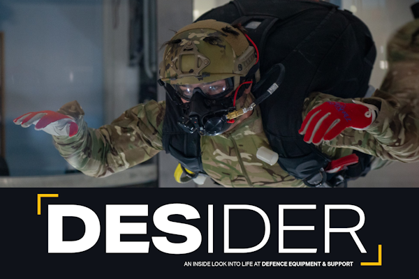 Desider cover showing parachutist wearing full breathing apparatus equipment in test free fall environment suspended in the air