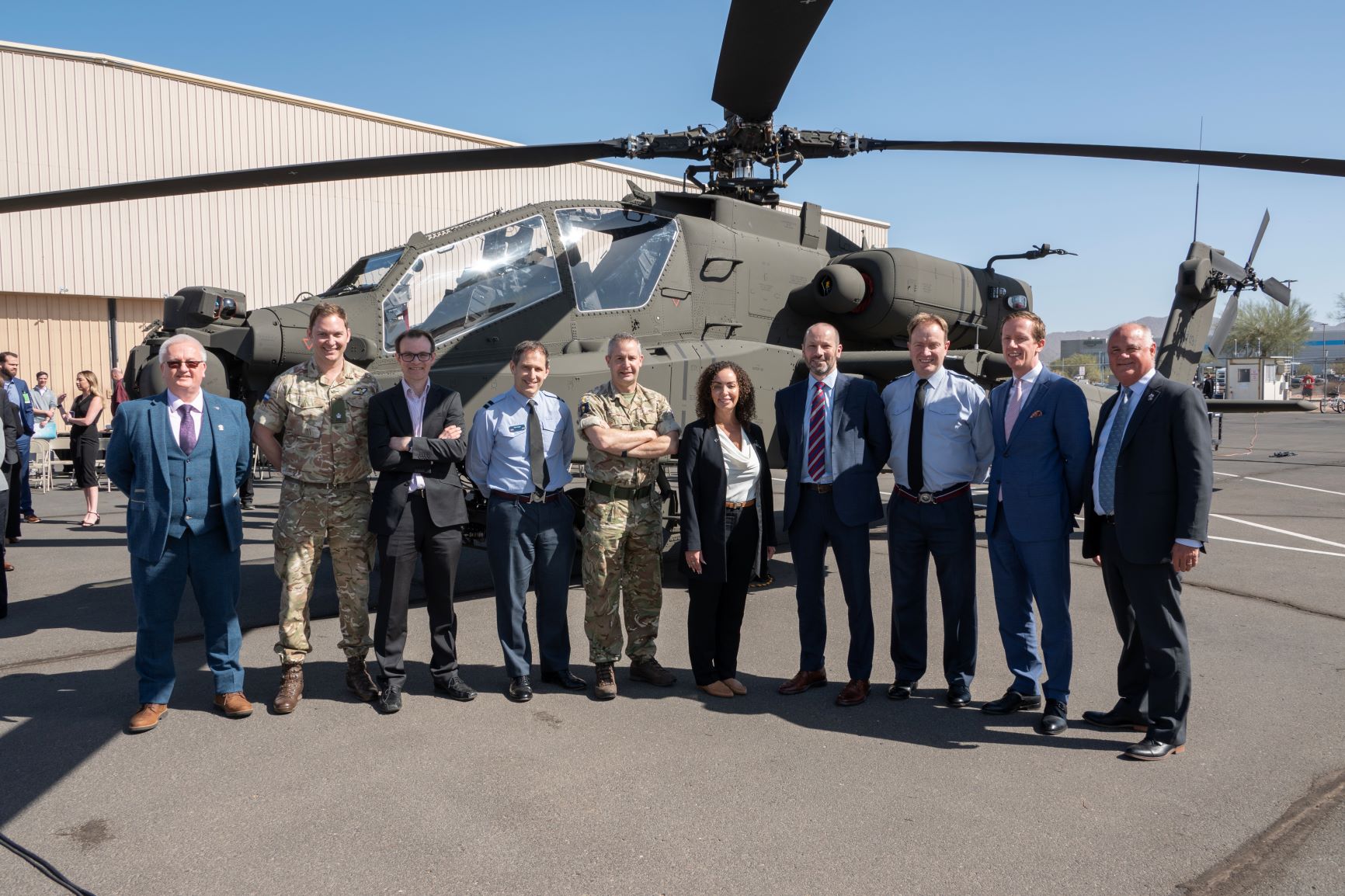 Members of DE&S, Boeing and the British Army in front of the 50th AH-64E Apache attack helicopter, which was accepted by DE&S at Boeing's manufacturing facility in Arizona