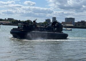 A Royal Navy Landing Craft Air Cushion (Light) (LCAC(L)) hovercraft on water